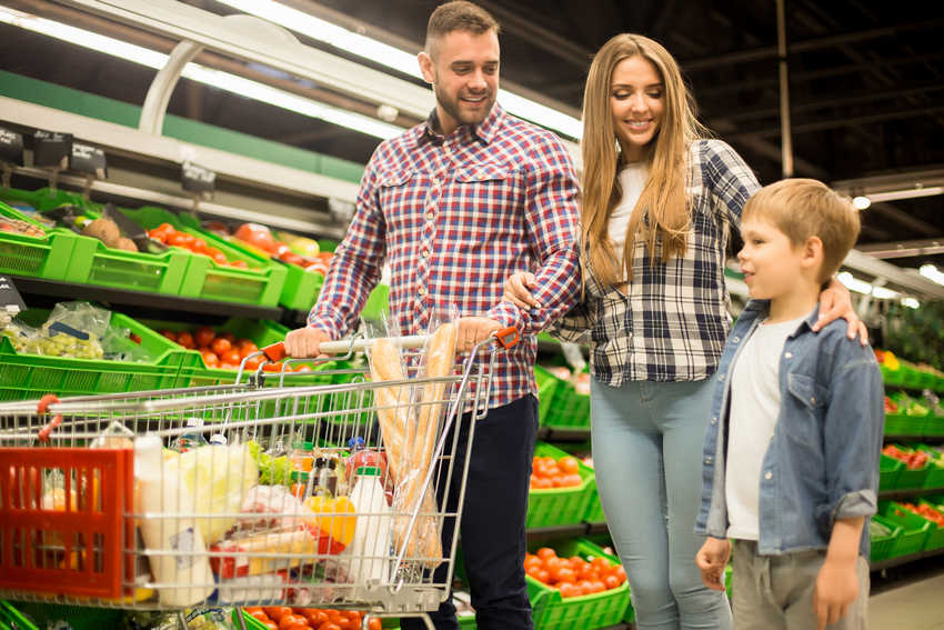 Young family shopping for produce