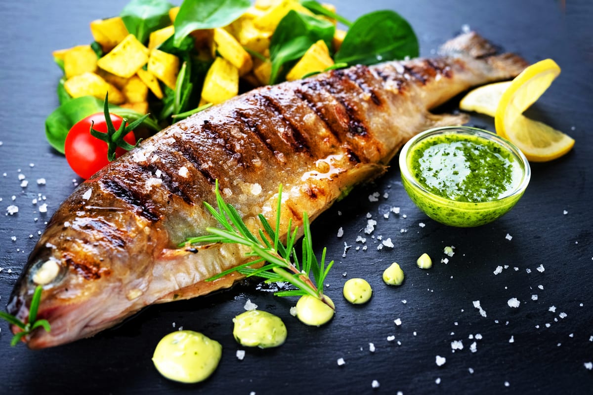 Trout with lemon, garlic, and herb sauce