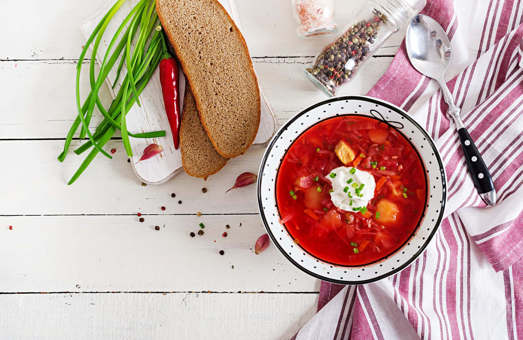 Bowl of ukrainian red soup with sour cream
